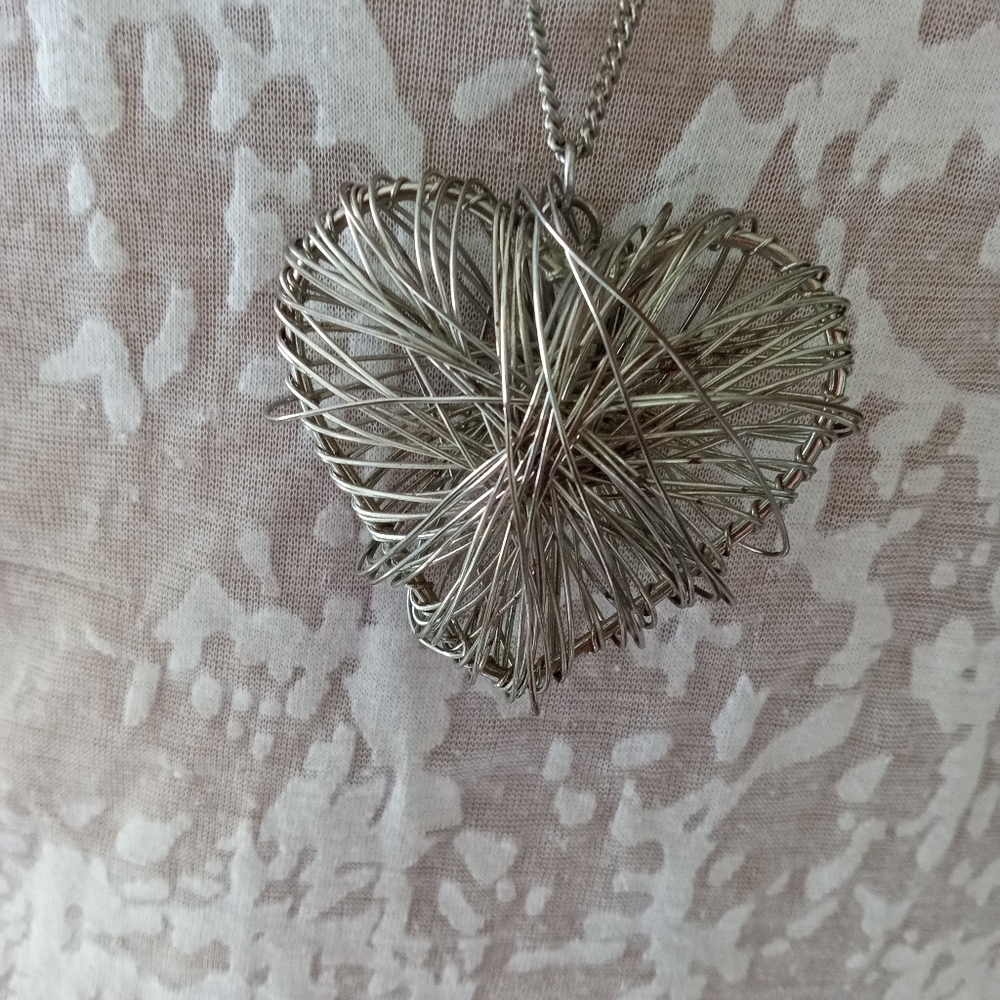 Silver wrapped wire puffy heart. long chain.